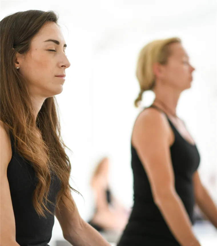 A teacher training cohort in a seated meditation